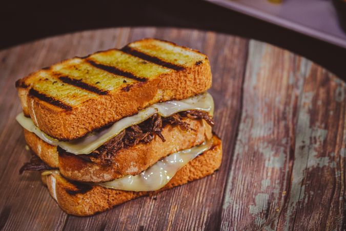 Triple patty melt with melted cheese