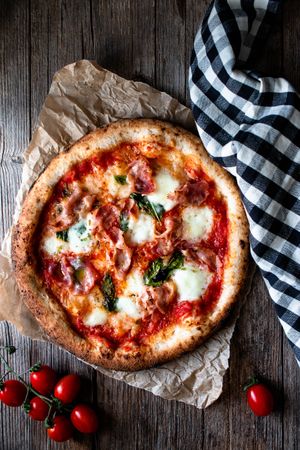 Appetizing pizza placed on wooden table