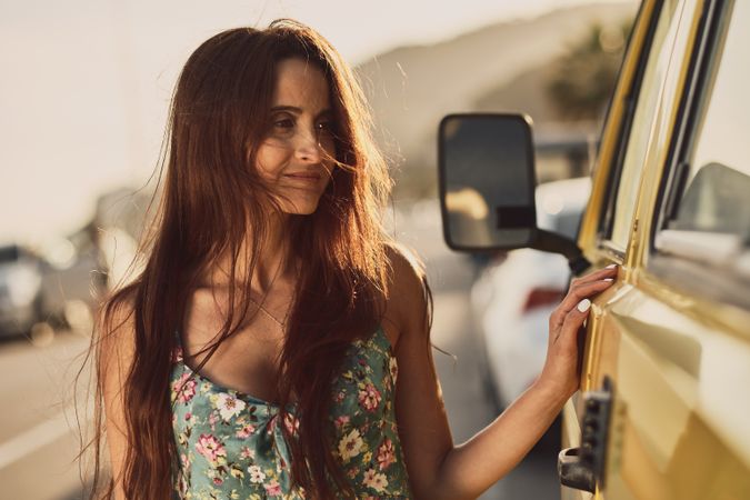 Young woman on a yellow van