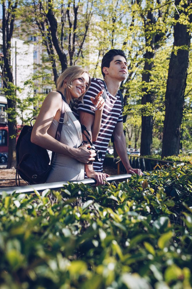 Young tourists couple standing outdoors
