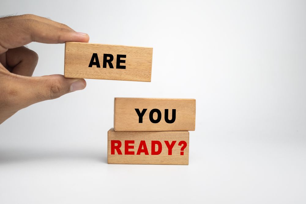 male hand putting wooden blocks with are you ready words text