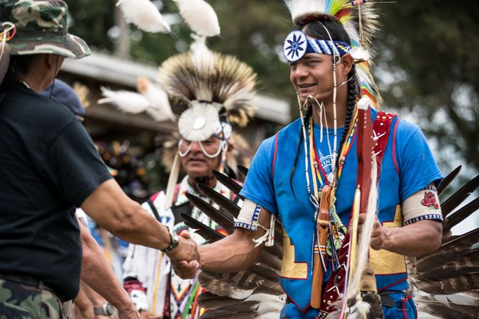 Red Wing, MN, USA - July 8th, 2017: Native American men shake hands after competition at Pow Wow