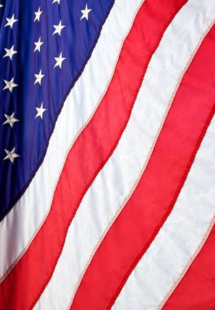 A vertical photo of the USA flag, stars and stripes