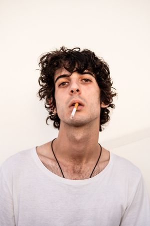 Adult smoker looking at camera