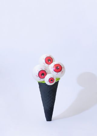 Eyeballs in dark ice cream cone in halloween concept