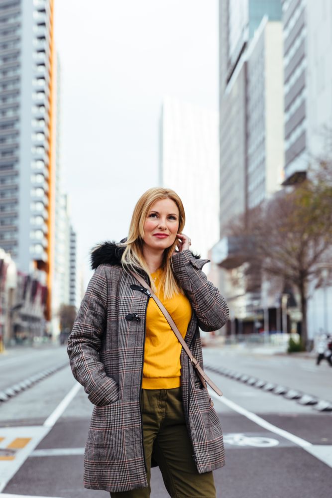 Blonde woman posing in the city