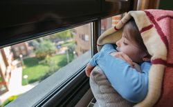 Sad girl looking out the window