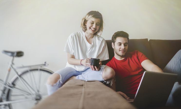 Couple on sofa on the computer