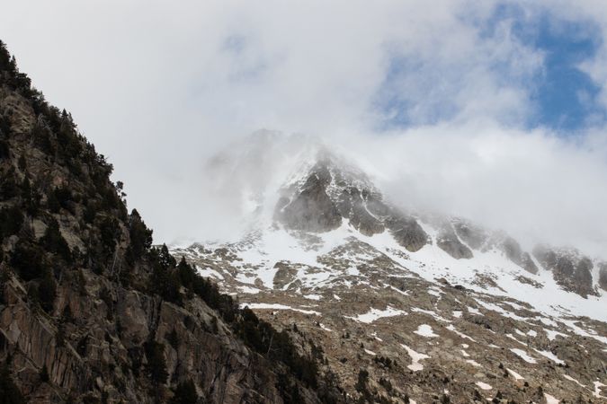 Rocky mountains covered with snow on sunny day