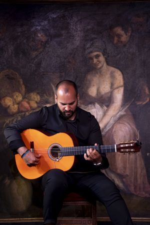 Man playing guitar on stage