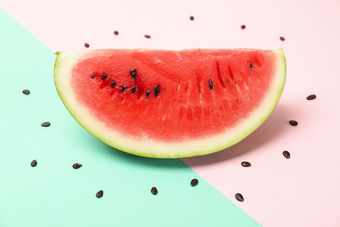 Fresh watermelon slice on two tone background. Summer fruit