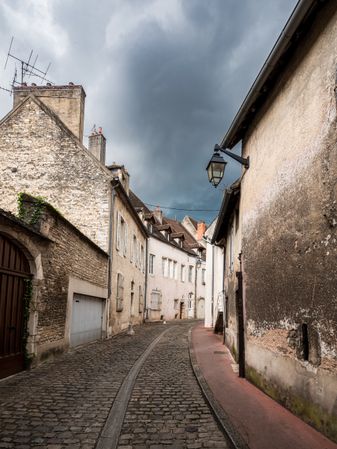 Empty streets of the medieval city of Beaune in Burgundy. The stormy sky