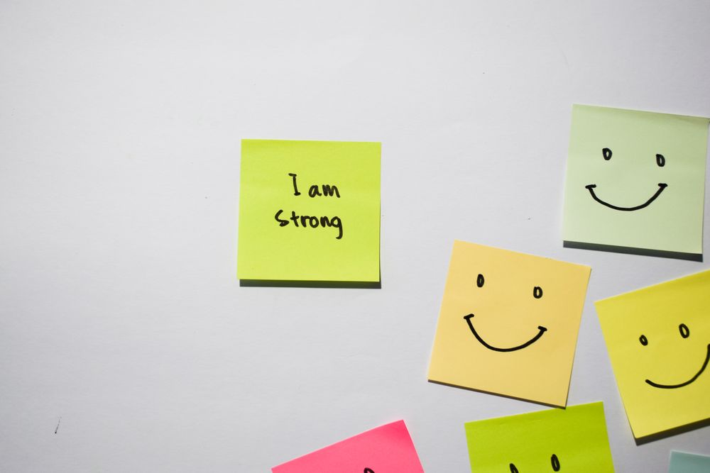 I am strong and smile emoticon on sticky notes