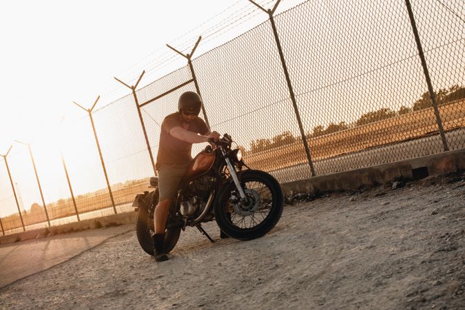 Strong man driving motorcycle