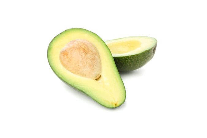 Ripe avocado halves isolated on blank background
