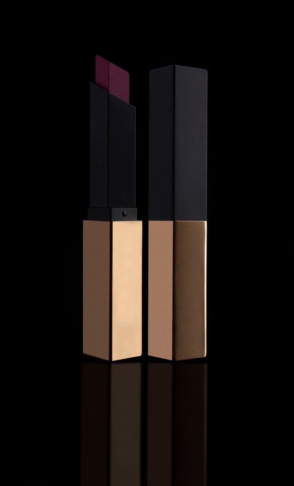 Stylish violet lipsticks in dark cases