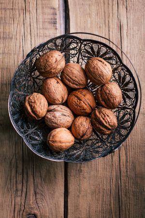 Ornamental basket with walnuts