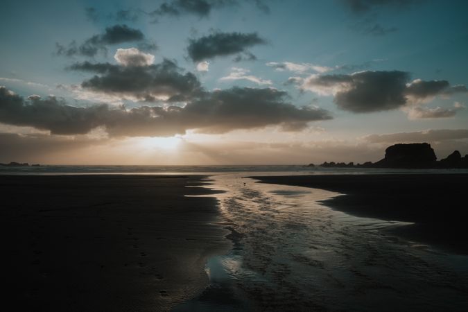 Beautiful sunset over sea with cloudy sky