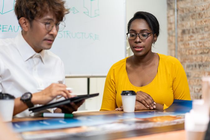 Employees having meeting discussing plans