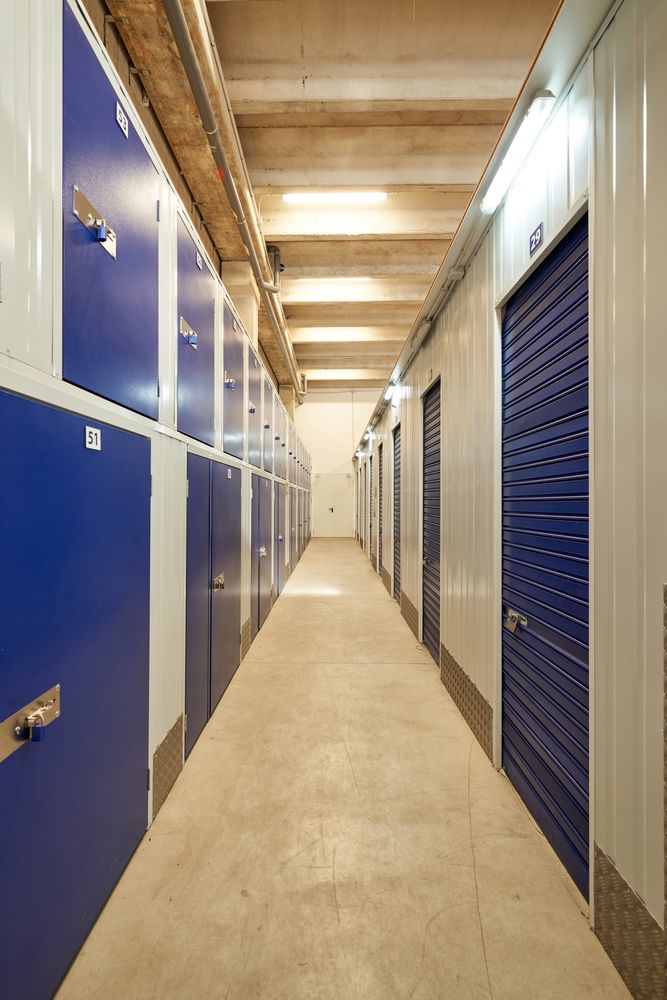 Long narrow corridor with storage in an industrial building for rental