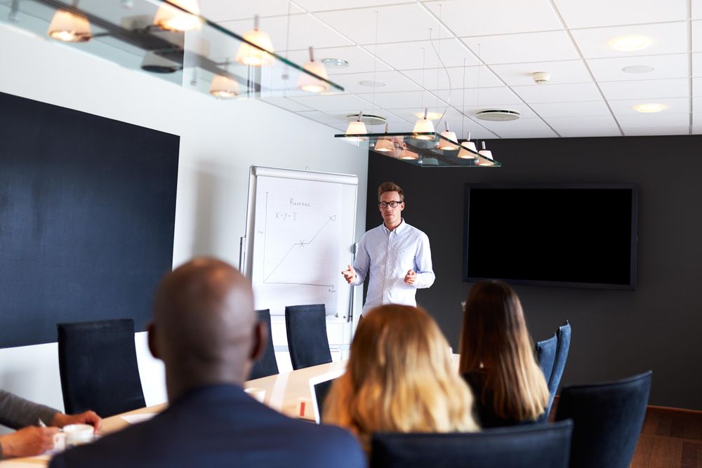 Businessman giving a presentation to his colleagues