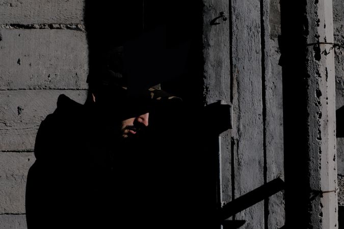 Modern man inside desolate building
