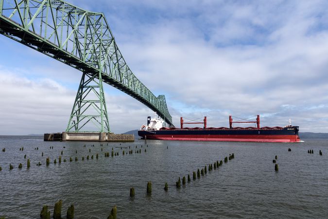 An oceangoing freighter passes Astoria-Megler cantilever bridge Megler, Washington