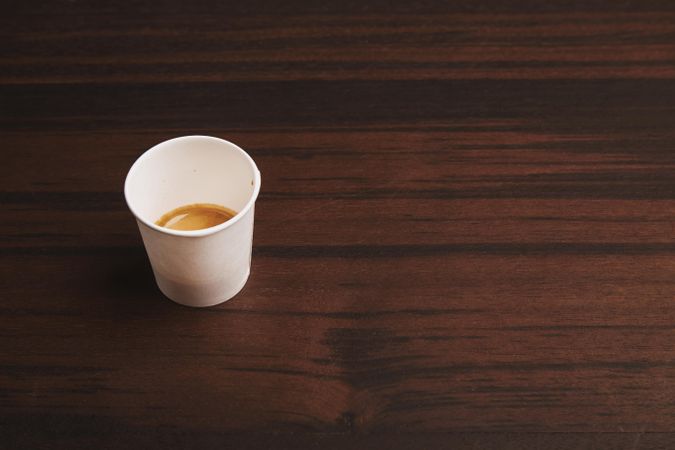 To-go espresso on wooden table