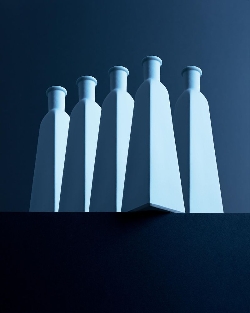 Tall bottles over dark background