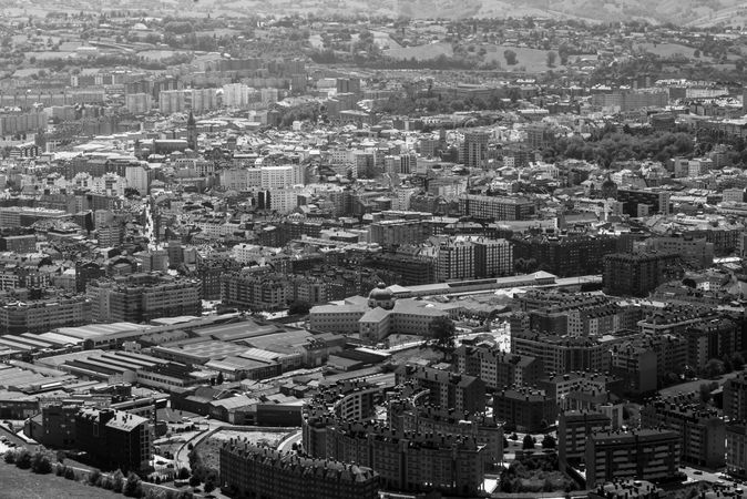 Modern buildings in city near mountains