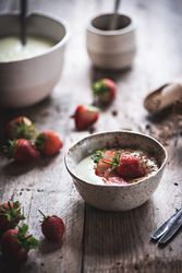 Strawberry porridge in bowl on table