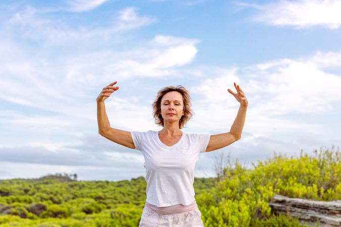 Adult woman practicing martial arts in nature