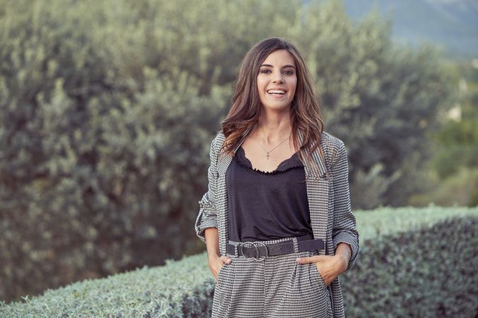 Joyful woman standing in countryside