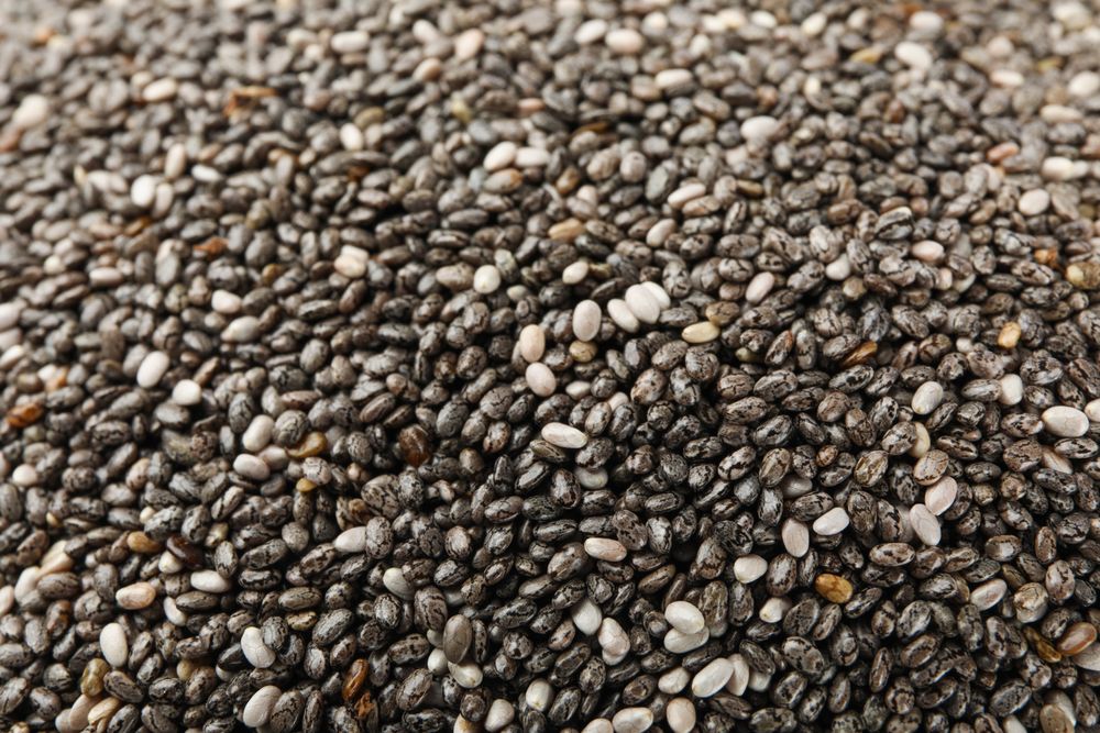 Chia seeds on whole background, close up