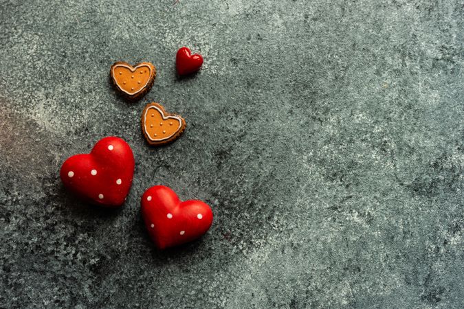 Valentine's day concept with heart shaped ornaments on grey counter
