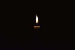 Candlelight burning in the dark