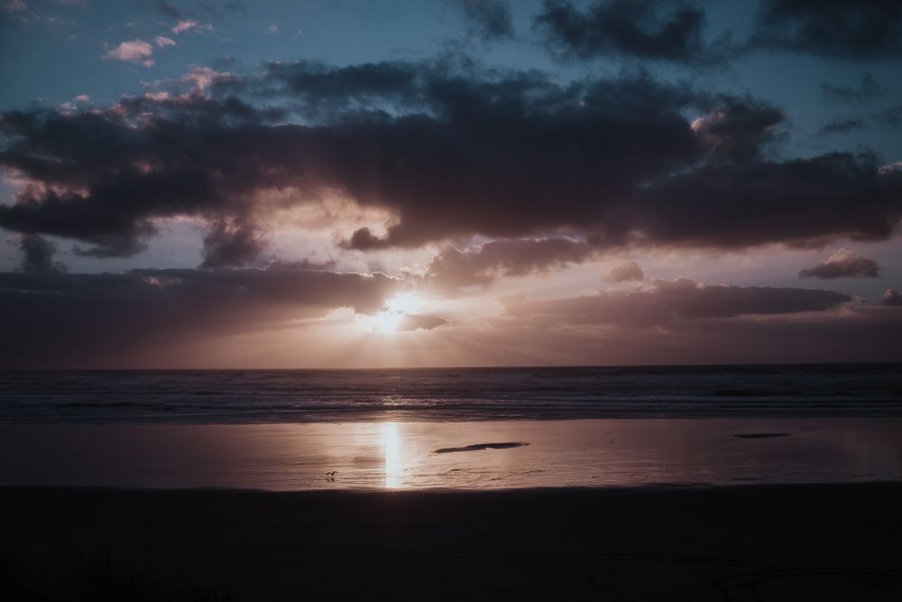 Beautiful sunset over sea with cloudy sky