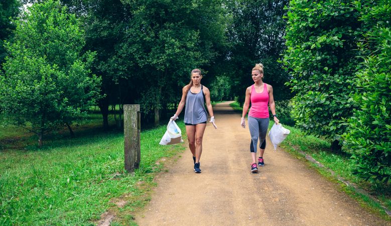 Two women doing plogging