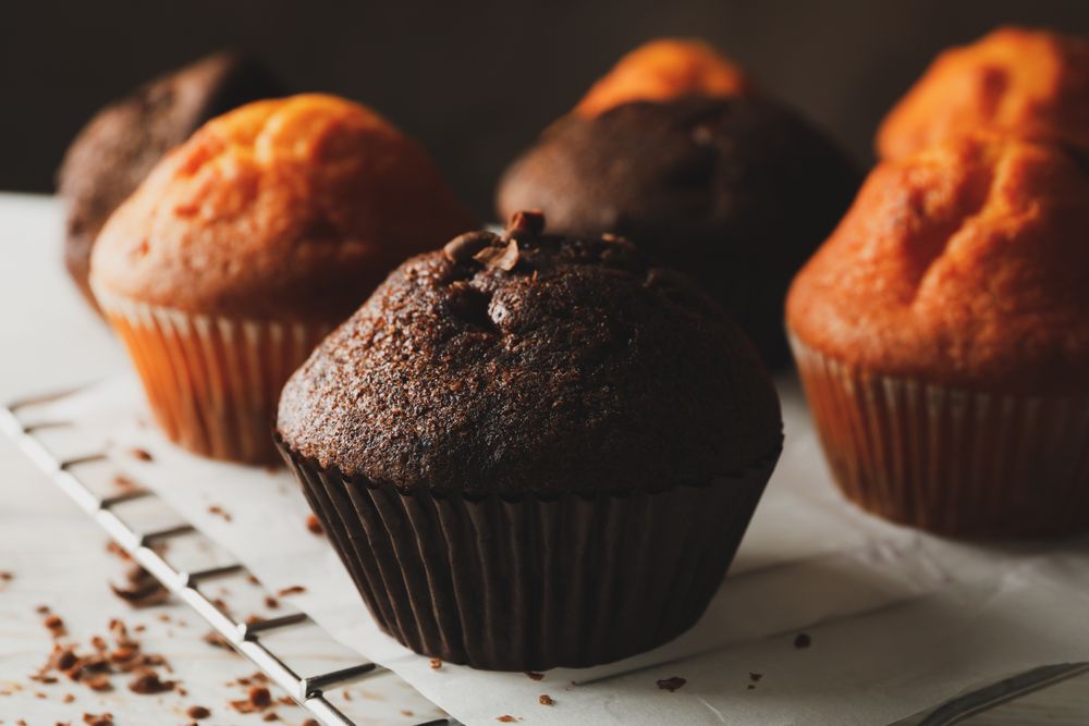 Composition with tasty muffins on wooden background