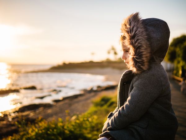 pensive girl at beach on winter
