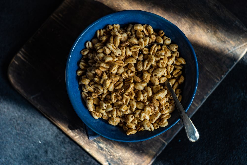 Top view of blue bowl of breakfast cereals