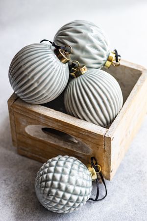 Wooden box with ceramic Christmas balls