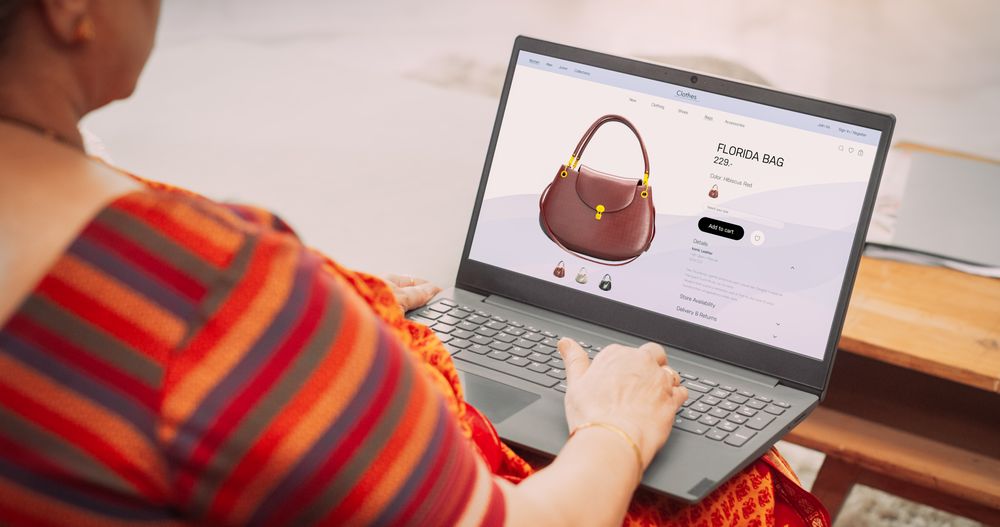 Over-the-Shoulder View of Mature Indian Woman Using Laptop