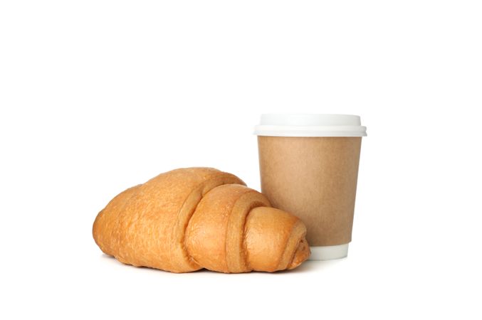 Baked croissant and paper cup isolated on plain background