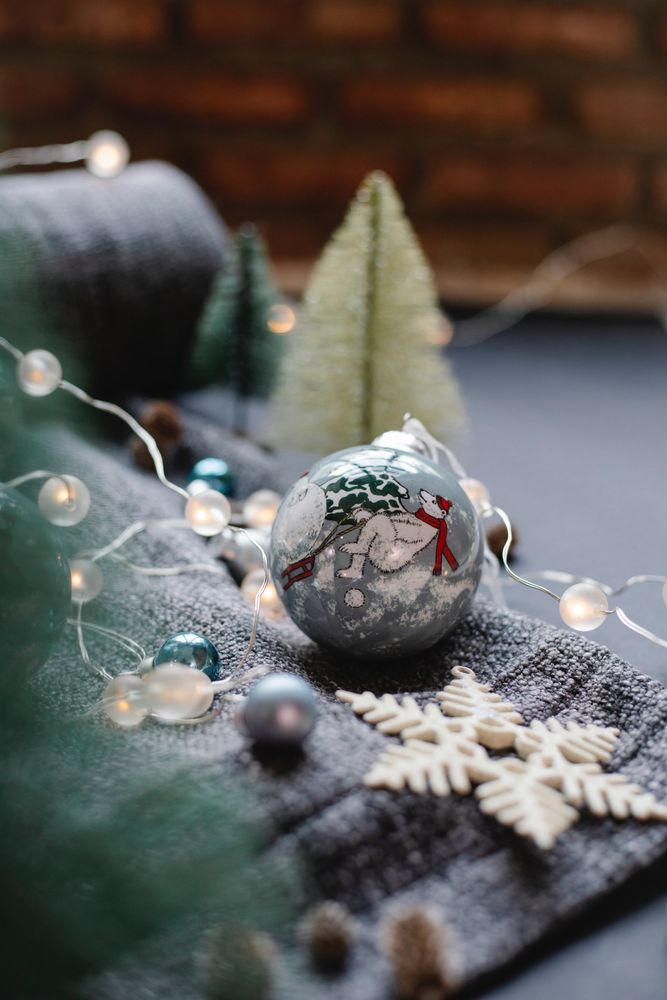 Silver Christmas ornament on textile
