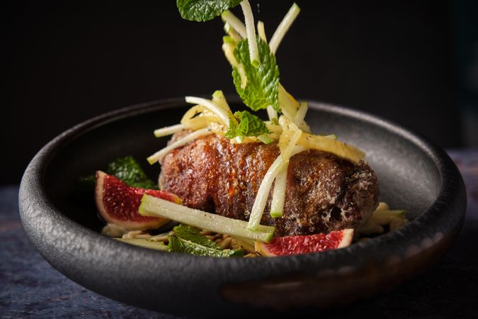Delicious pig trotter with vegetables served in plate