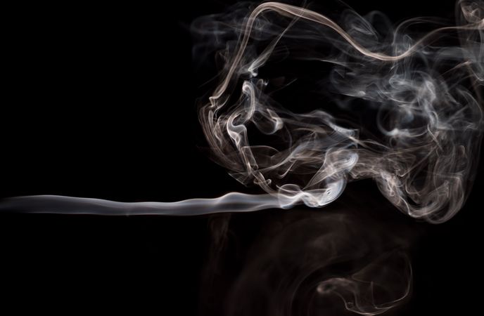 Abstract smoke moving on dark background