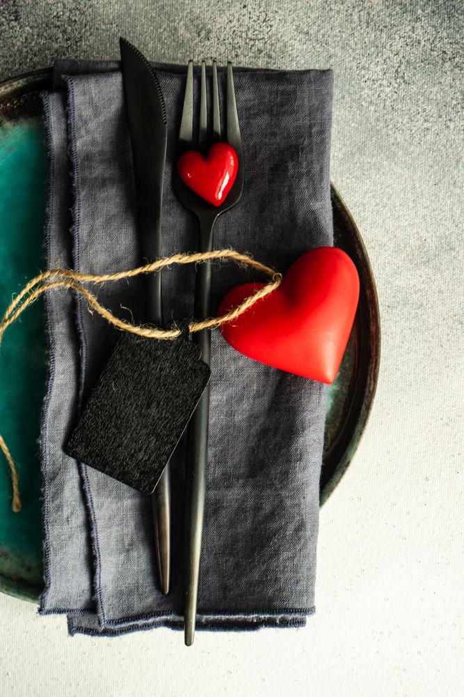 St. Valentine day card close up of cutlery with hearts