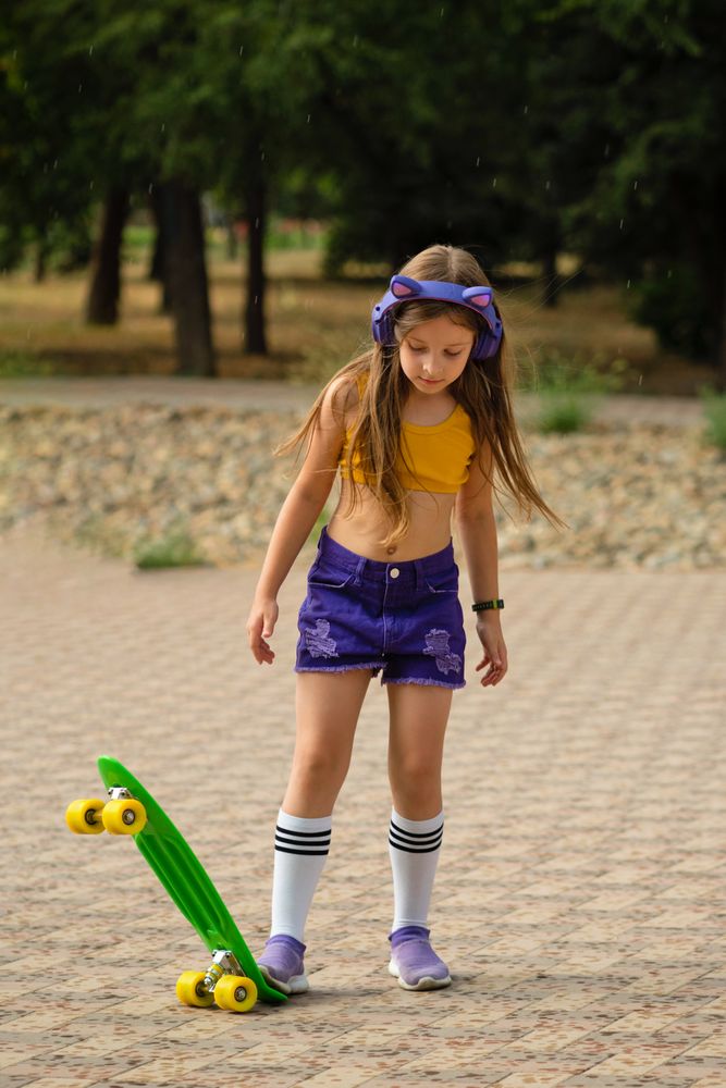 Female Child On Skateboard