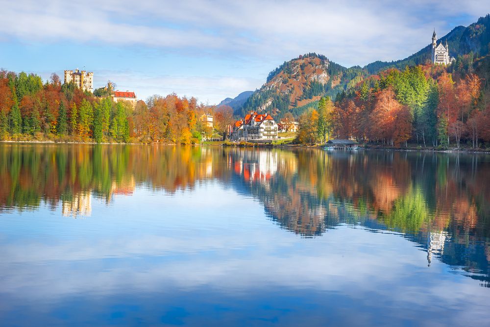 Castles in Hohenschwangau on the Aplsee lake with fall leaves